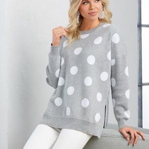 Gray sweater with white dots.